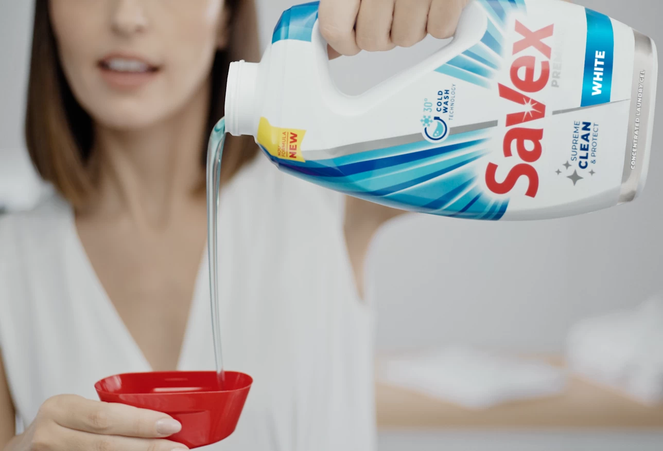 Savex Premium detergent measured into the cap