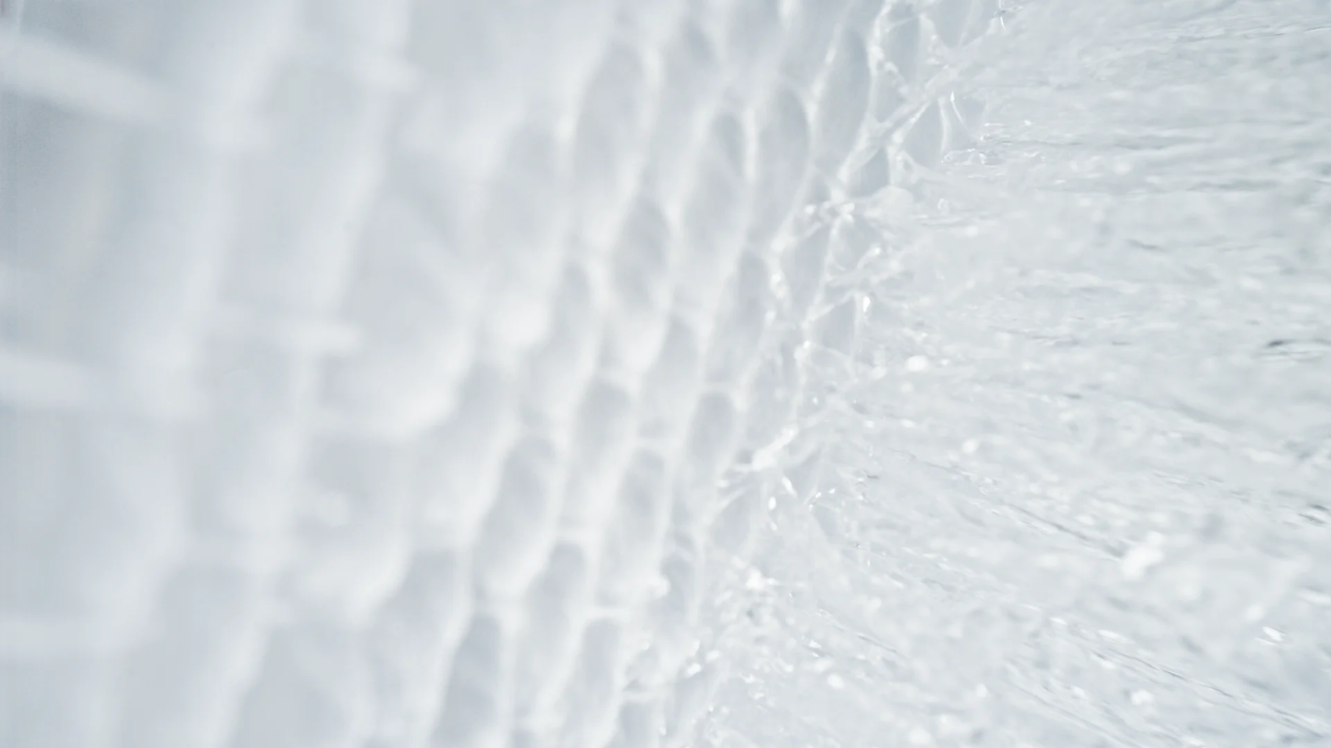 Clear water rippling over clean white fabric
