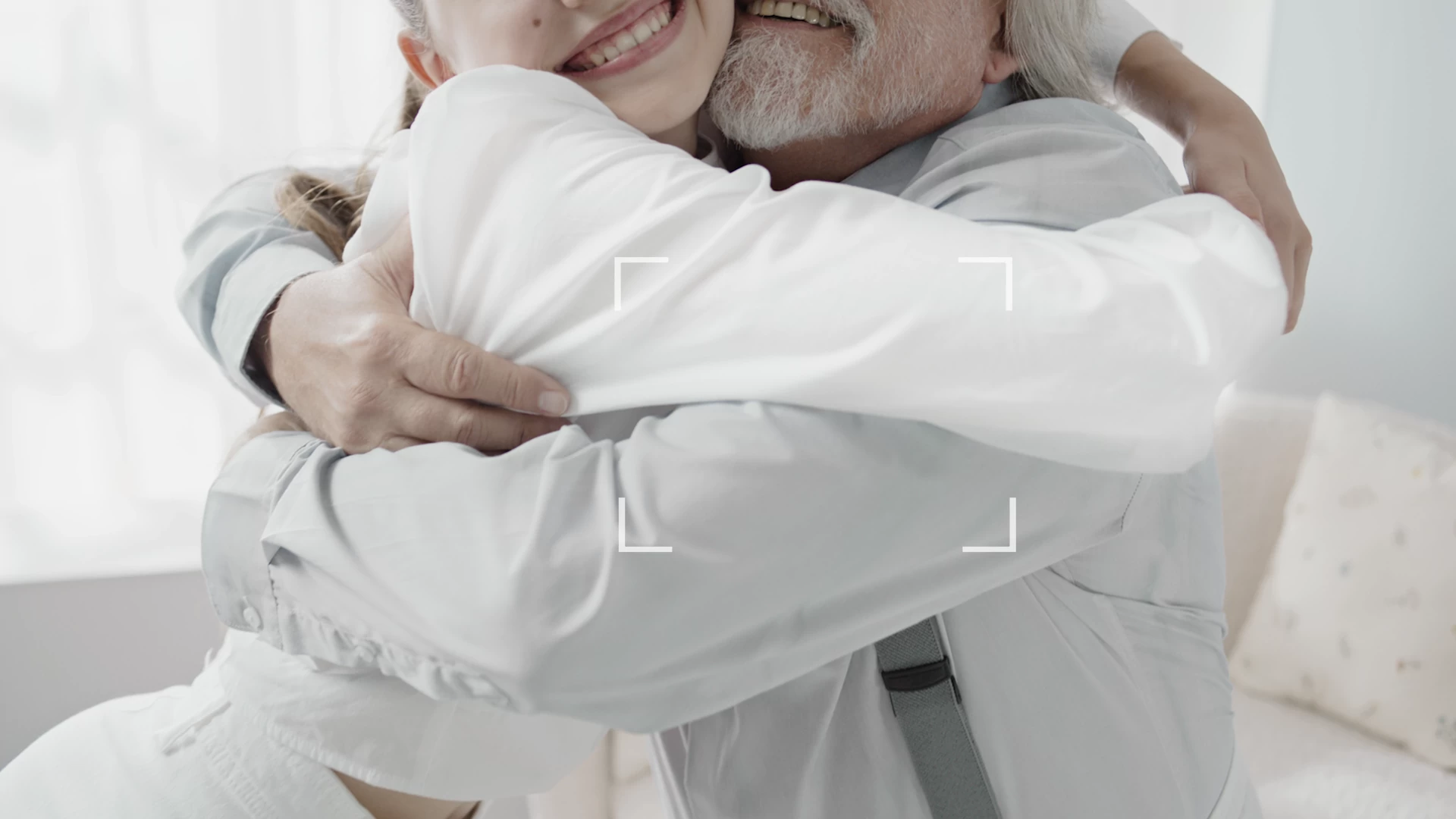 Two people embracing, wearing soft, fresh white clothing